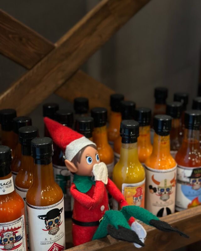 Elf on the Shelf is back at The Bruce Craft House! Spice things up this season with A & Jay’s Hot Sauce! 🔥🌶️—perfect for adding a little heat to your holidays!  Think you can handle it? Our elf might need some milk! Find your fiery fix at the Grab & Go spot right beside the front desk in the main lobby.  #hotsauce #hotsaucelover #cambridgehotel #thebruce #elf #elfontheshelf #cambridgerestaurant #spiceupyourlife #holiday #holidayseason